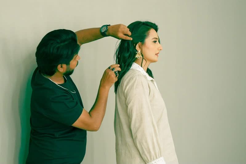 Shoaib Bashir with a client at Shoaib Salon