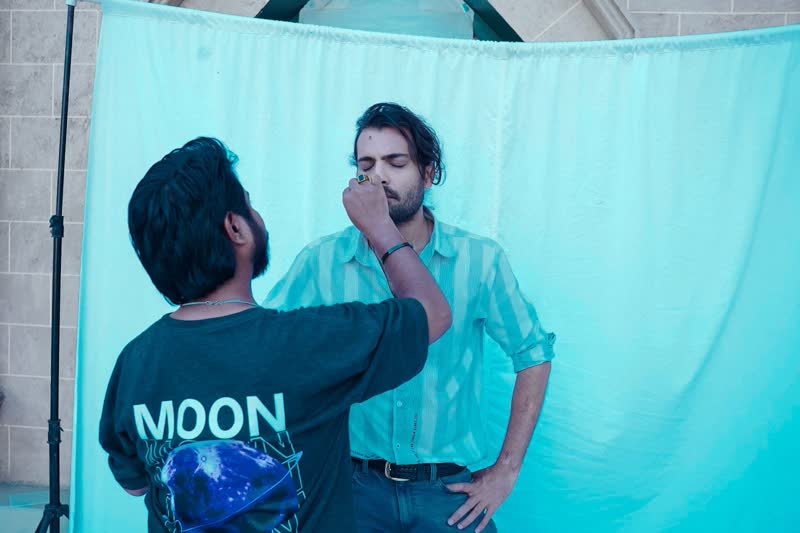 Shoaib Bashir with a client at Shoaib Salon
