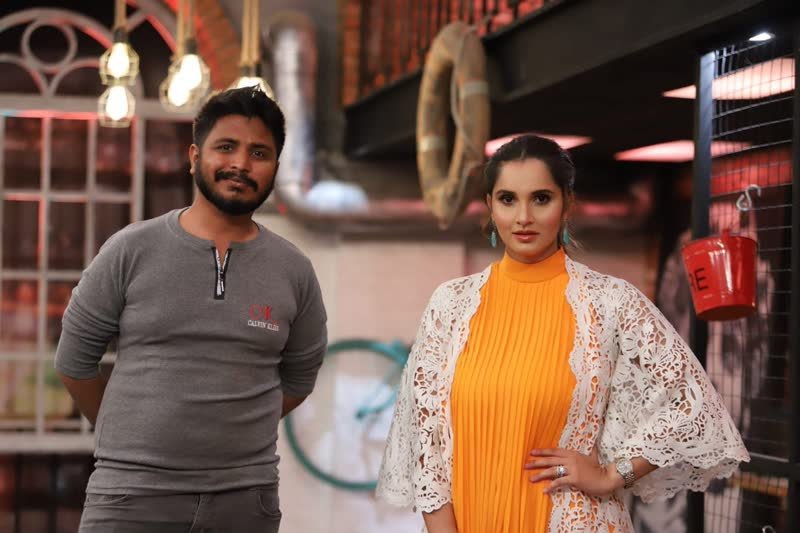 Shoaib Bashir with a client at Shoaib Salon