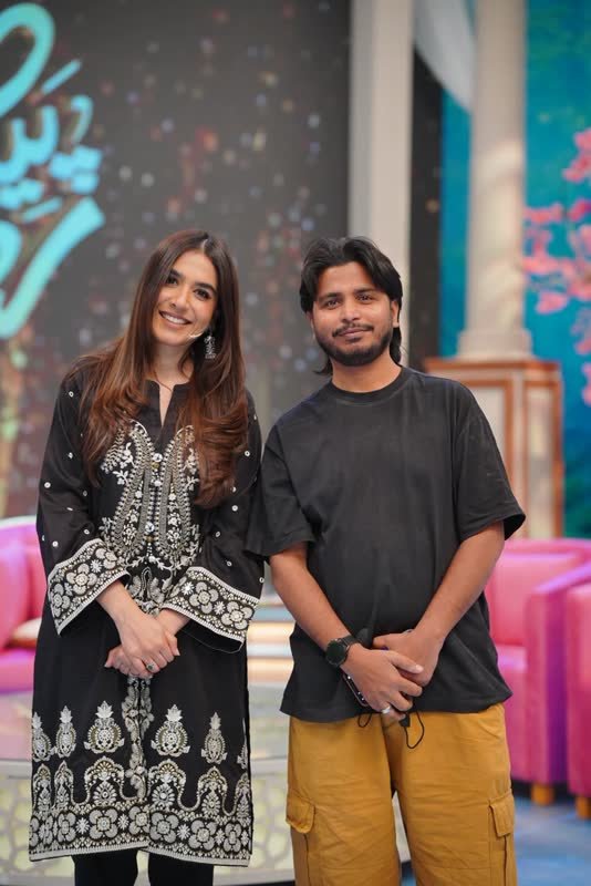 Shoaib Bashir with a client at Shoaib Salon